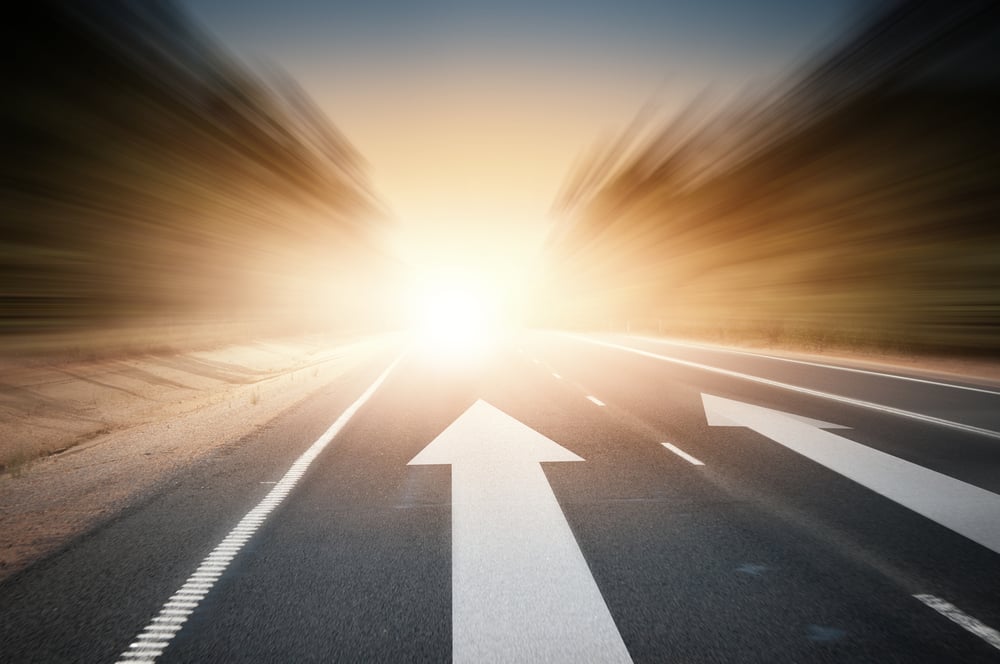 Conceptual image of asphalt road and direction arrow